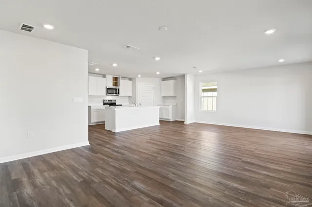 a view of kitchen with wooden floor