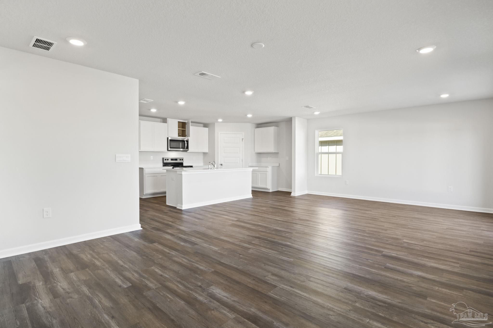 5072 Rainwater Road Milton, FL 32583 - Photo 4 of 18 a view of kitchen with wooden floor