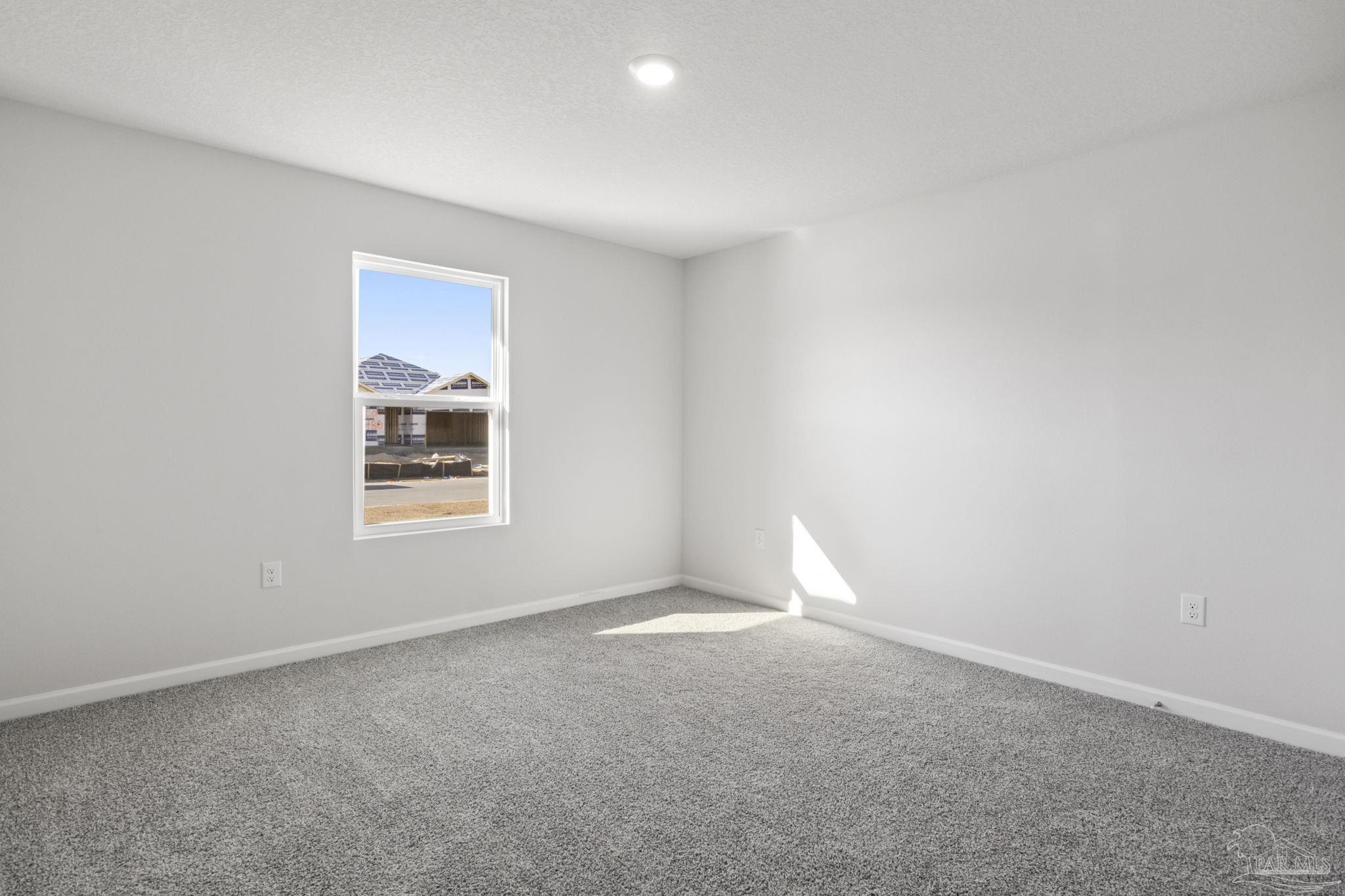 5072 Rainwater Road Milton, FL 32583 - Photo 5 of 18 an empty room with windows