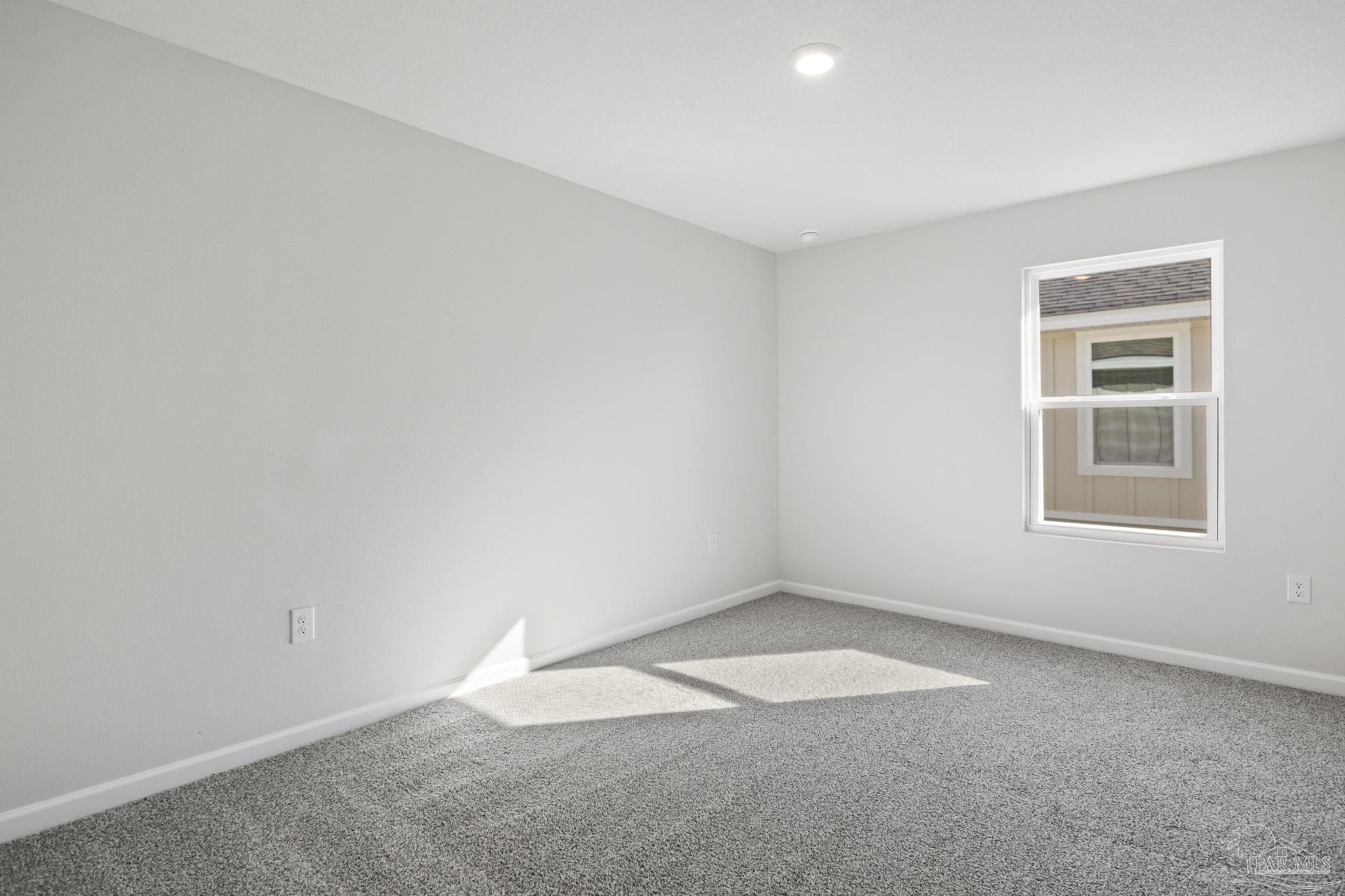 5072 Rainwater Road Milton, FL 32583 - Photo 8 of 18 an empty room with windows