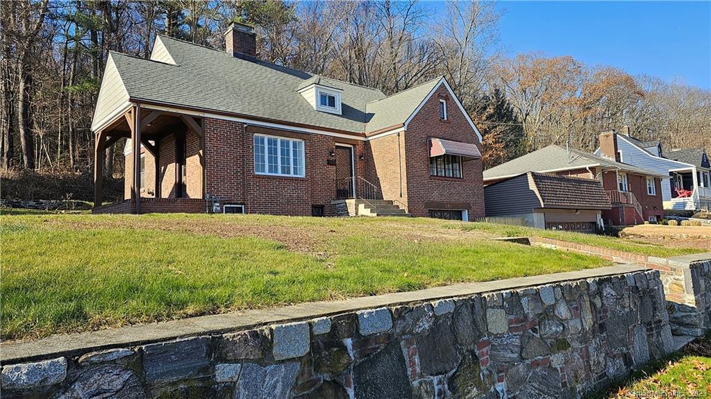 203 Spring Street Torrington, CT 06790 - Photo 1 of 1 a house view with a garden space