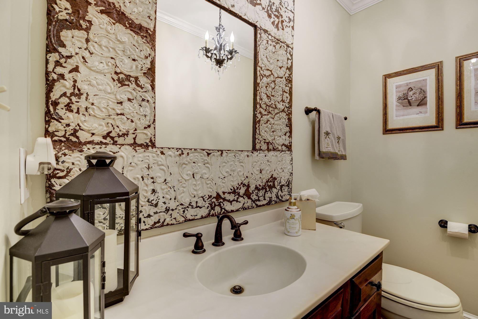 6 Beall Spring Court Potomac, MD 20854 - Photo 15 of 54 Half Bath with Chandelier