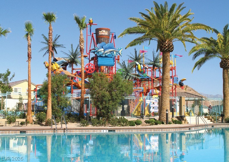 87 Tall Ruff Drive Las Vegas, NV 89148 - Photo 5 of 71 An inviting pool alongside a vibrant water park offers endless recreation.