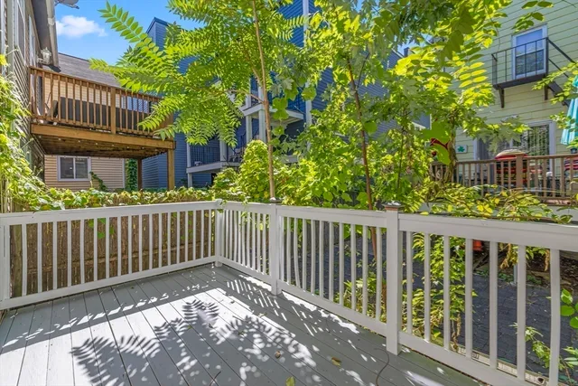 a balcony with wooden floor in front of it