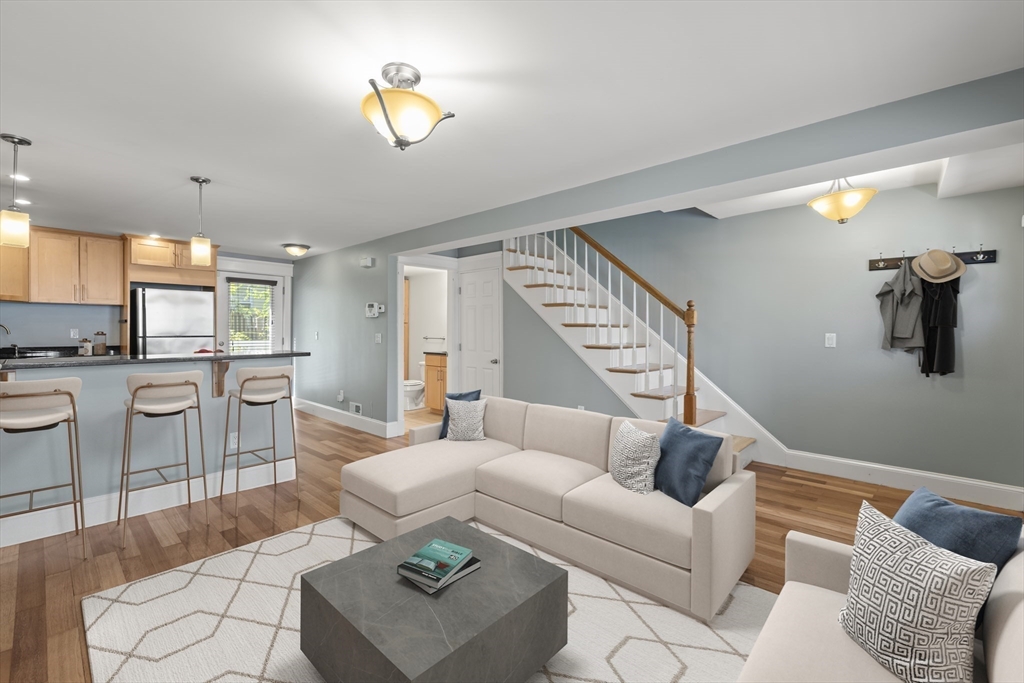 45 Ward Street Boston, MA 02127 - Photo 4 of 16 a living room with furniture and kitchen view