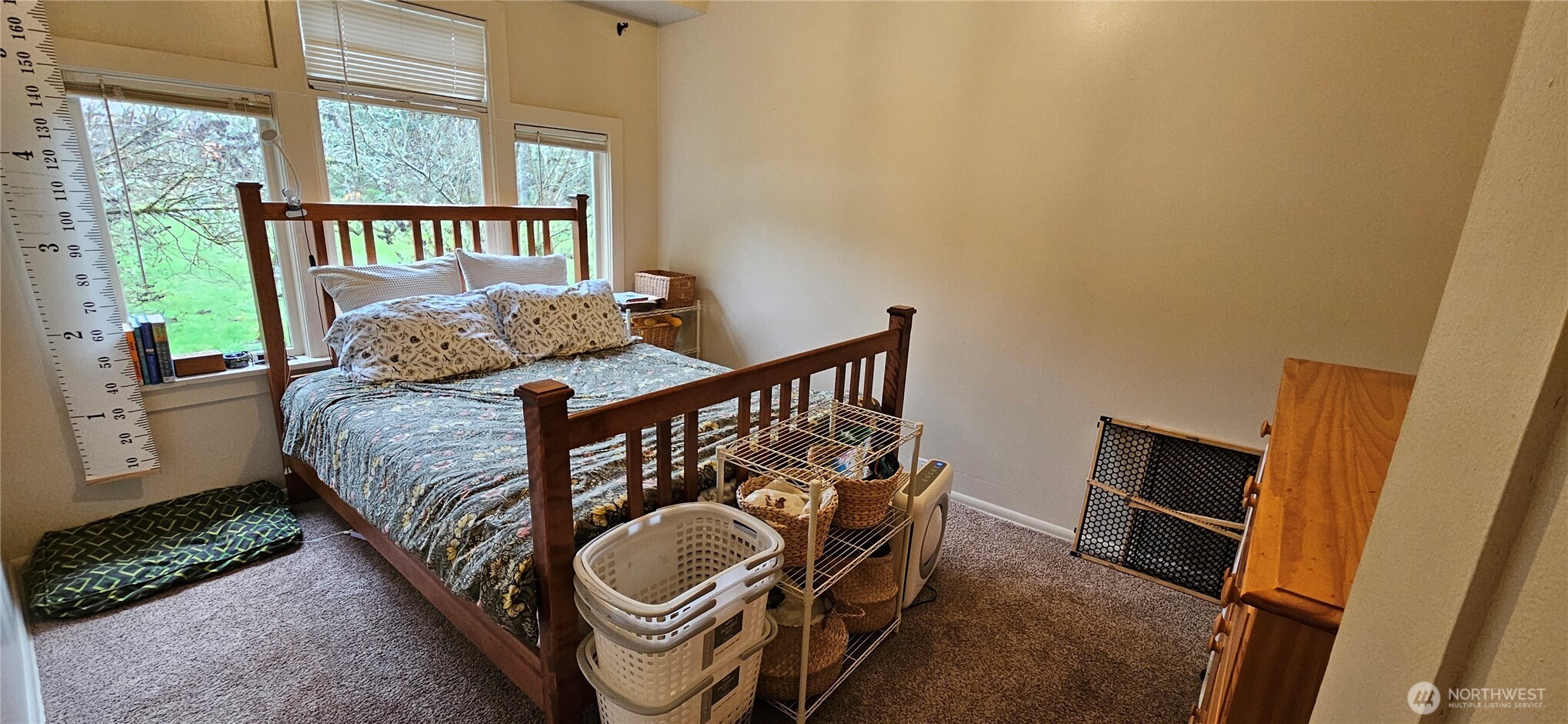 6810 Northeast Bergman Road Bainbridge Island, WA 98110 - Photo 19 of 24 a bedroom with a bed and a window