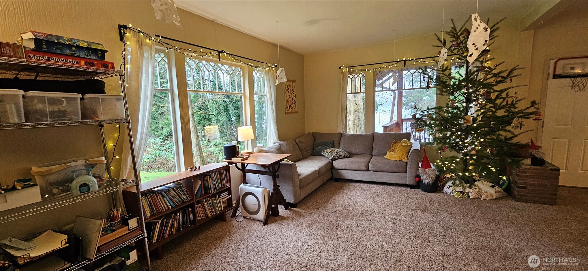 6810 Northeast Bergman Road Bainbridge Island, WA 98110 - Photo 20 of 24 a living room with furniture and a window