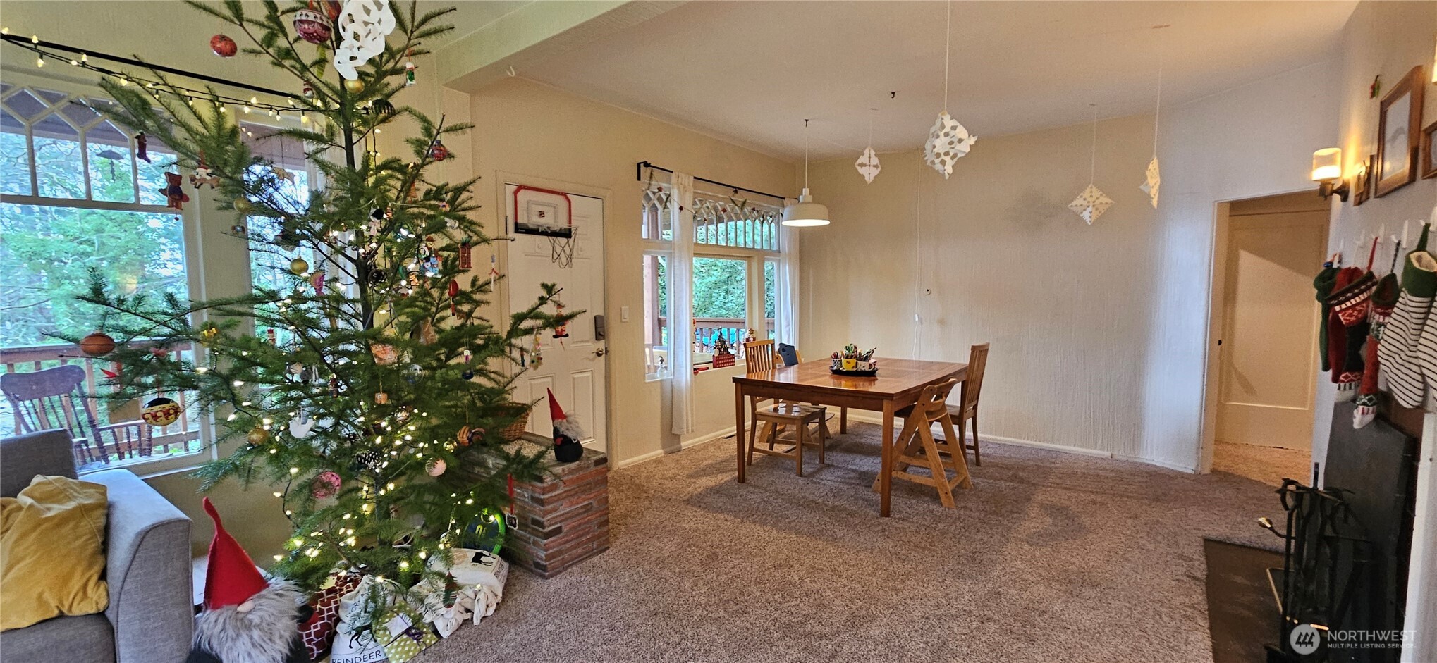 6810 Northeast Bergman Road Bainbridge Island, WA 98110 - Photo 21 of 24 a view of a dining room with a table and chairs