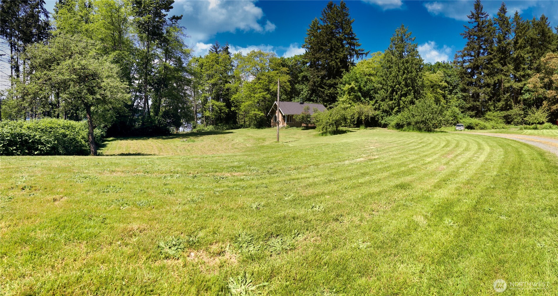 6810 Northeast Bergman Road Bainbridge Island, WA 98110 - Photo 3 of 24 a swimming pool with an outdoor space
