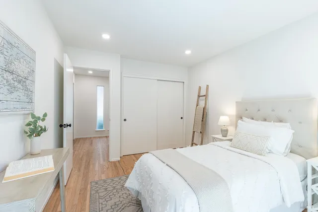 a bedroom with a bed and a couch