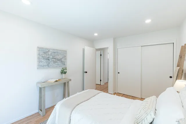 a bedroom with a bed and a cabinets