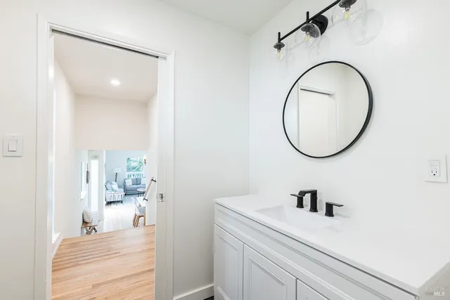 a bathroom with a sink and a mirror