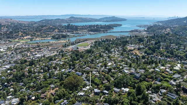 an aerial view of residential house and outdoor space
