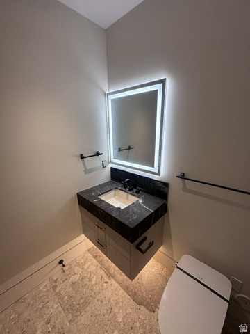 1918 Chimney Rock Road Heber City, UT 84032 - Photo 68 of 74 Contemporary floating vanity with black stone countertop, integrated basin, and matte black faucet