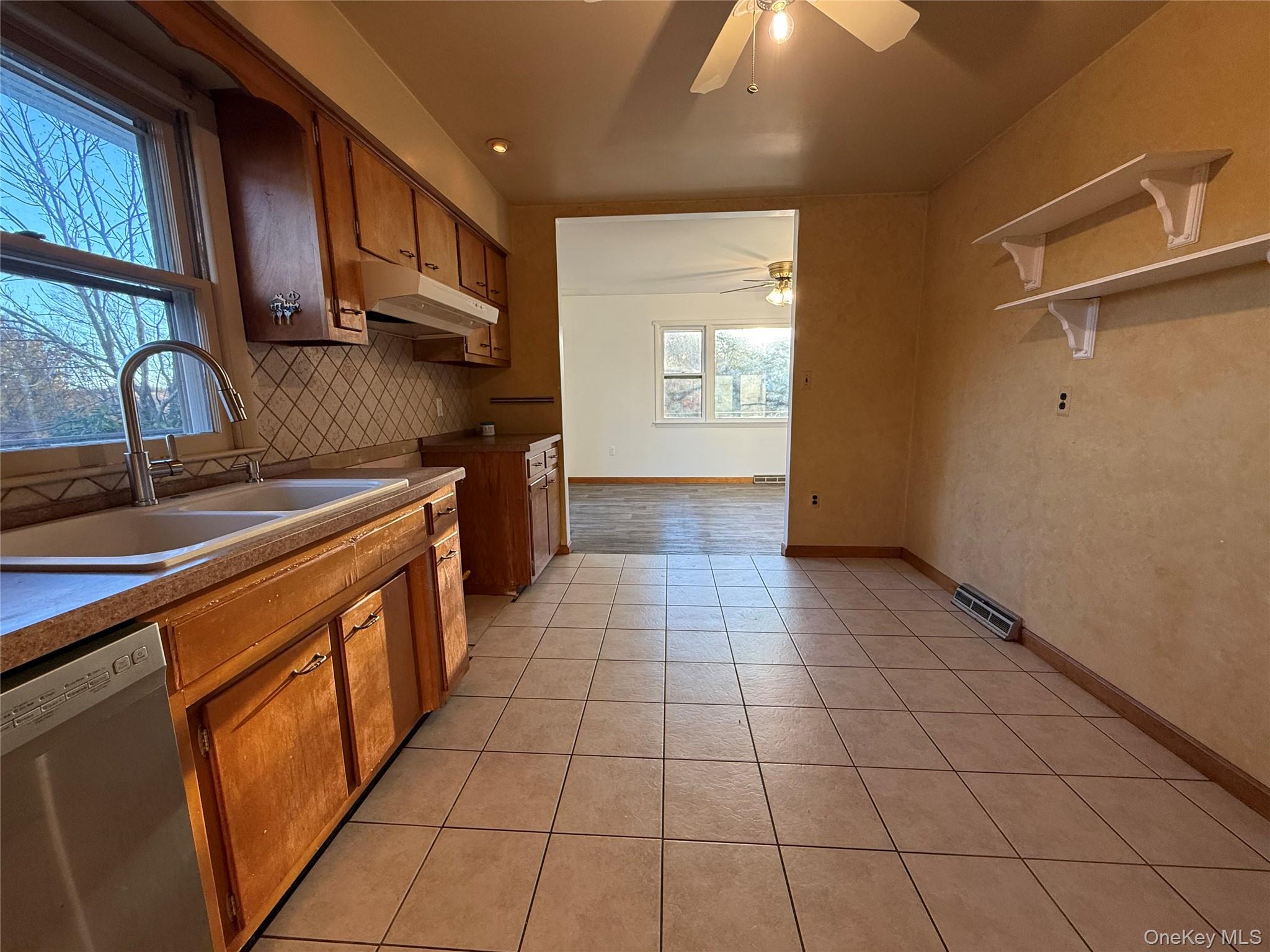 90 North Road Bloomingburg, NY 12721 - Photo 11 of 13 a kitchen with stainless steel appliances granite countertop a stove a sink and a microwave