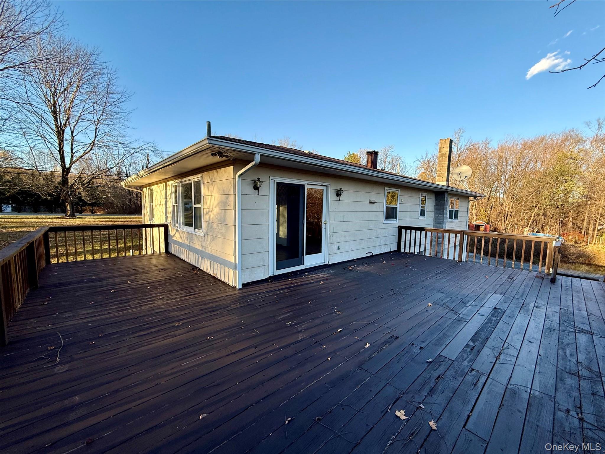 90 North Road Bloomingburg, NY 12721 - Photo 2 of 13 a view of a roof deck with wooden floor and fence