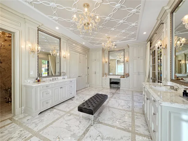 a bathroom with a double vanity sink mirror and