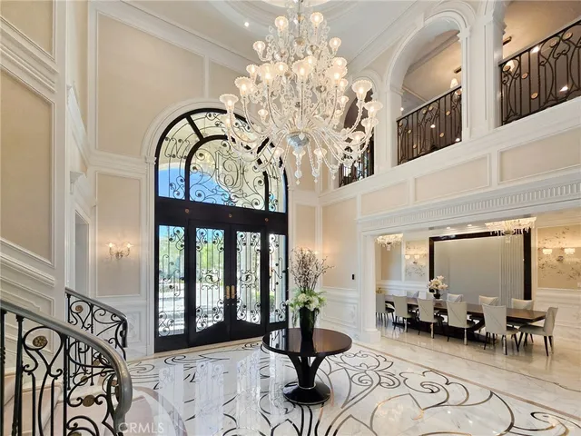 a living room with furniture and large windows