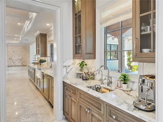 a view of a double vanity sink and a window