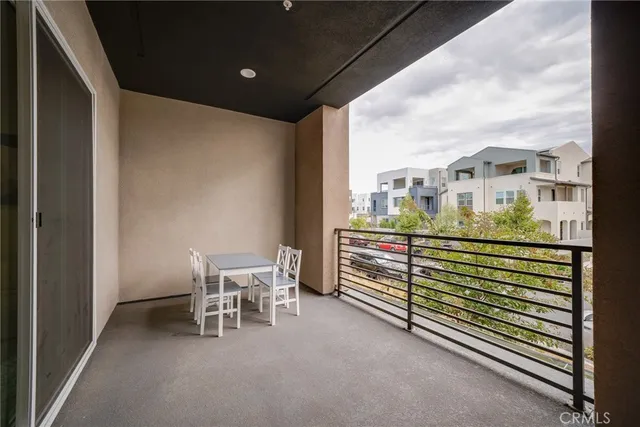 a view of a chair and table in the balcony