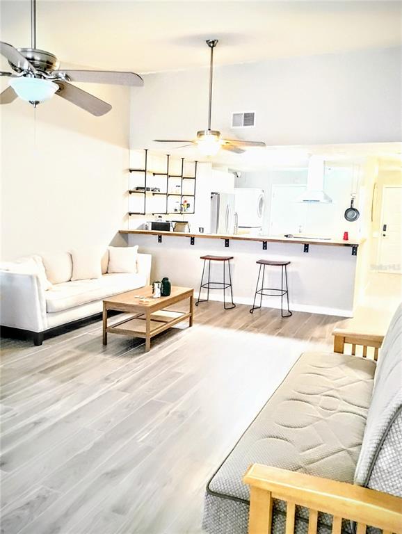 2012 Dover Court Oldsmar, FL 34677 - Photo 6 of 7 a living room with furniture and a table