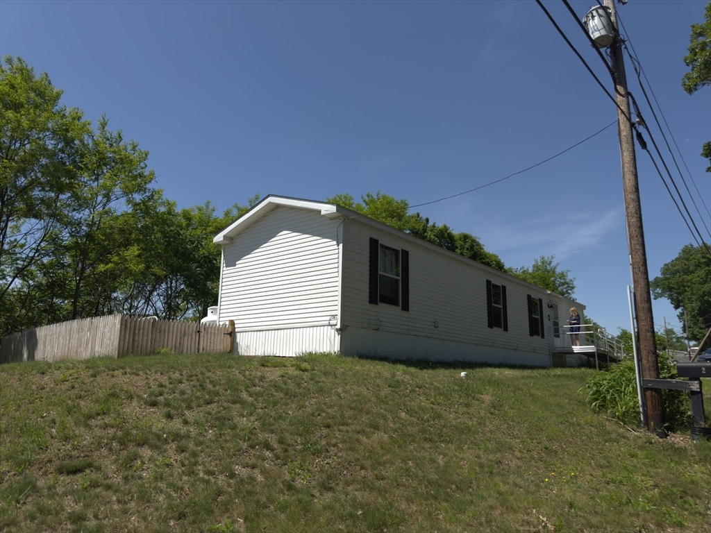 46 Madden Road, Unit 2 West Brookfield, MA 01585 - Photo 13 of 22 a house with trees in the background