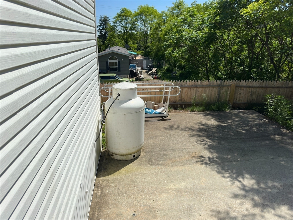 46 Madden Road, Unit 2 West Brookfield, MA 01585 - Photo 17 of 22 a view of backyard with outdoor seating and stairs