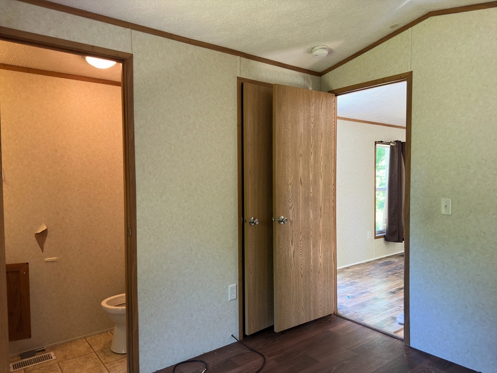46 Madden Road, Unit 2 West Brookfield, MA 01585 - Photo 9 of 22 a view of a hallway with wooden floor