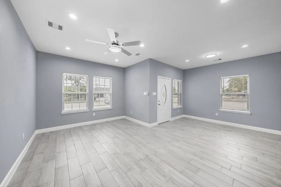 5222 Bataan Road Houston, TX 77033 - Photo 18 of 22 Spacious interior with contemporary tones and seamless flow, creating a warm yet luxurious atmosphere.