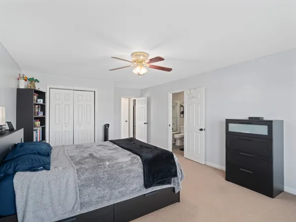 a bedroom with a bed and closet
