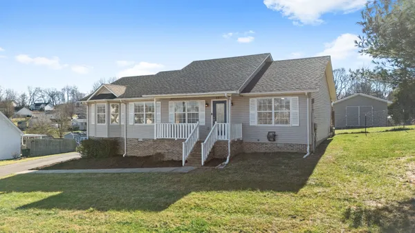 a front view of a house with a yard