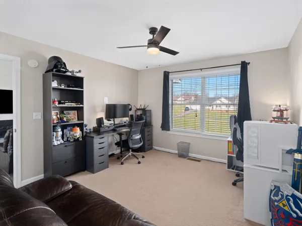 a workspace with a window and a couch