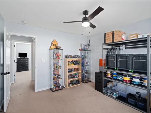 a living room with a flat screen tv and a walk in closet