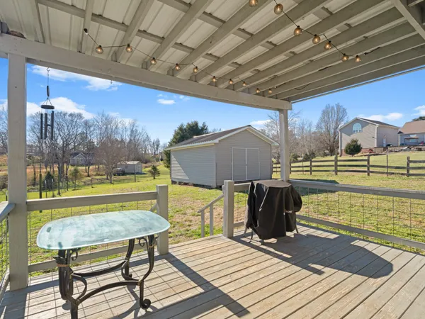 a view of a swimming pool with a patio