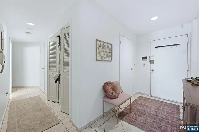 a view of a hallway with bathroom