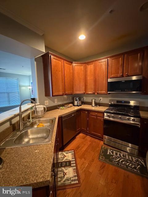 108 Leather Fern Way Frederick, MD 21702 - Photo 4 of 22 a kitchen with stainless steel appliances granite countertop a stove a sink and a microwave