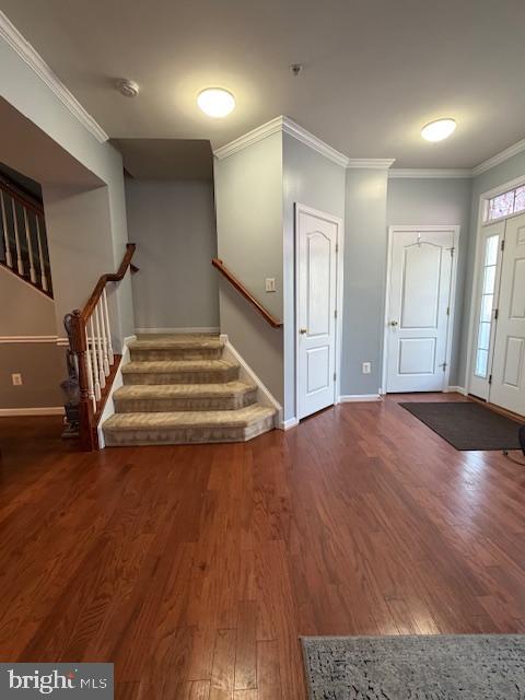 108 Leather Fern Way Frederick, MD 21702 - Photo 7 of 22 a view of a livingroom with wooden floor and stairs