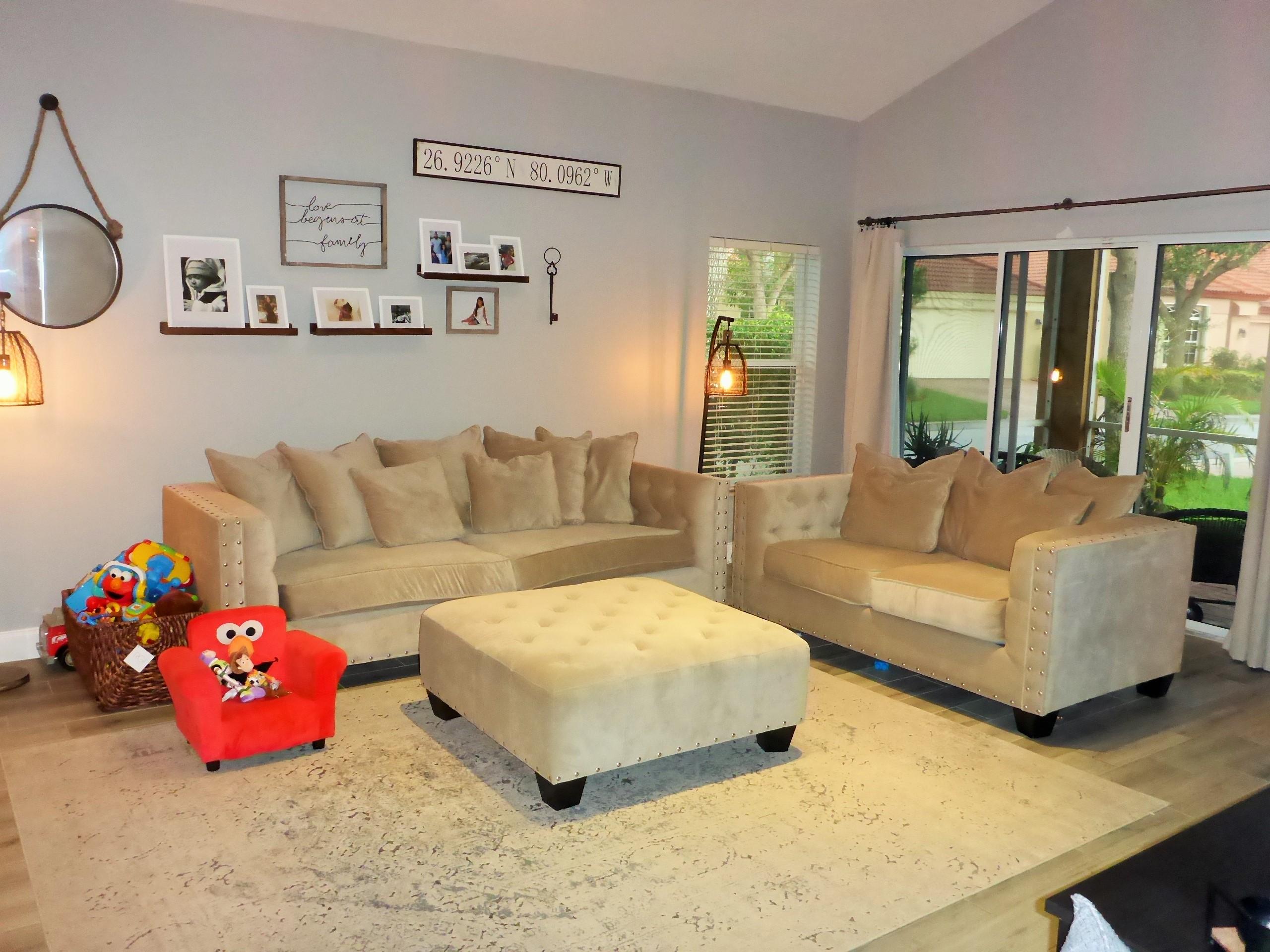 5009 Elpine Way Riviera Beach, FL 33418 - Photo 12 of 41 a living room with furniture and a large window