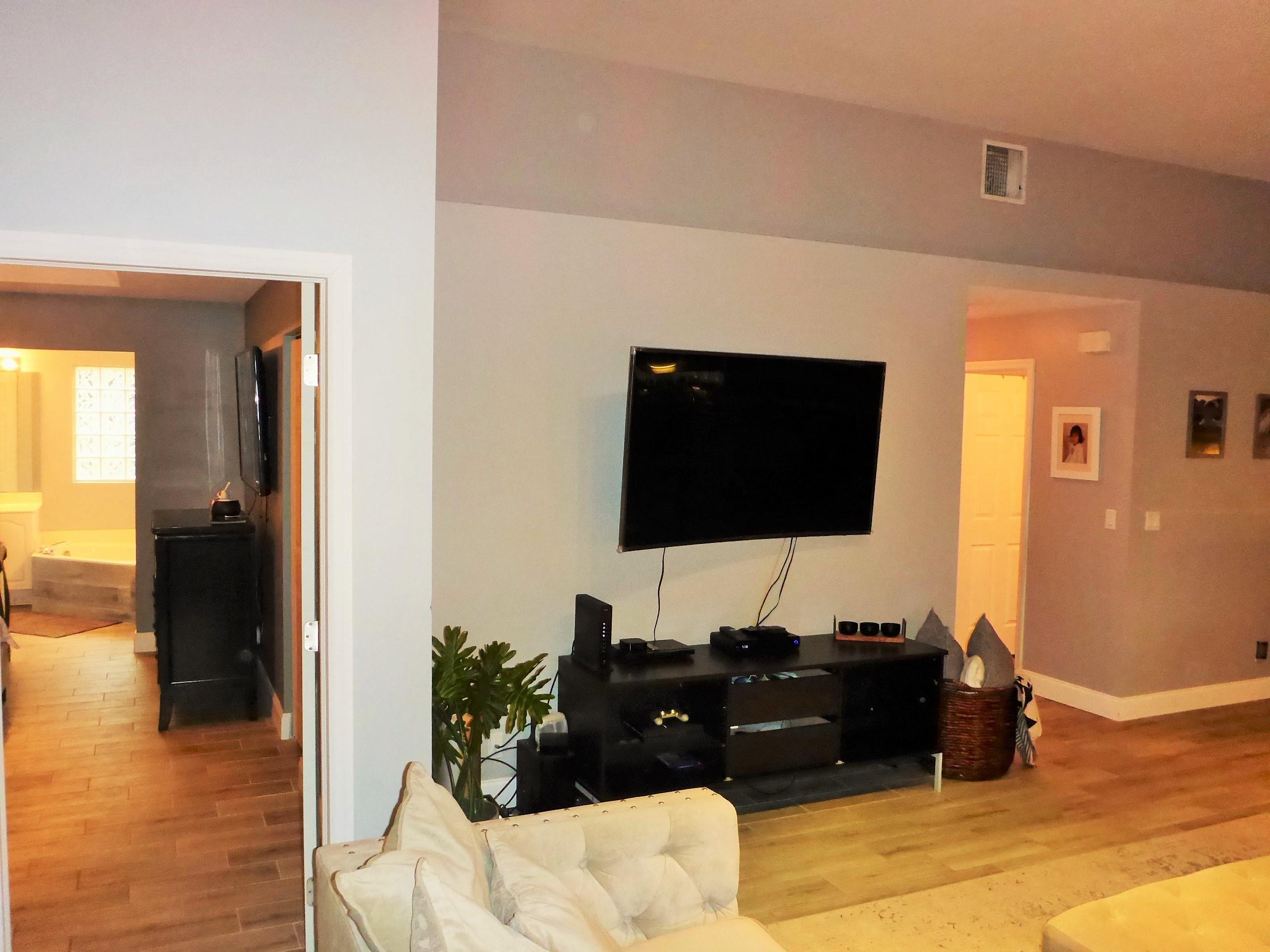 5009 Elpine Way Riviera Beach, FL 33418 - Photo 14 of 41 a living room with furniture and a flat screen tv