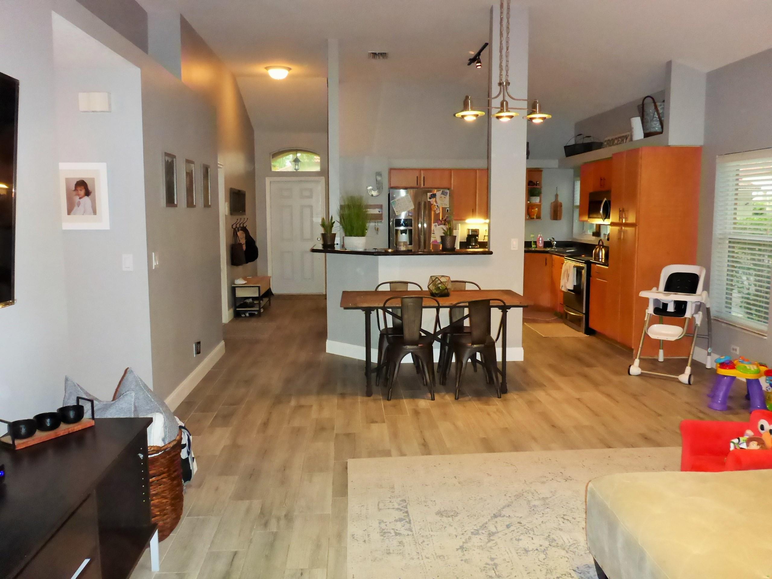 5009 Elpine Way Riviera Beach, FL 33418 - Photo 15 of 41 a view of a dining room with furniture