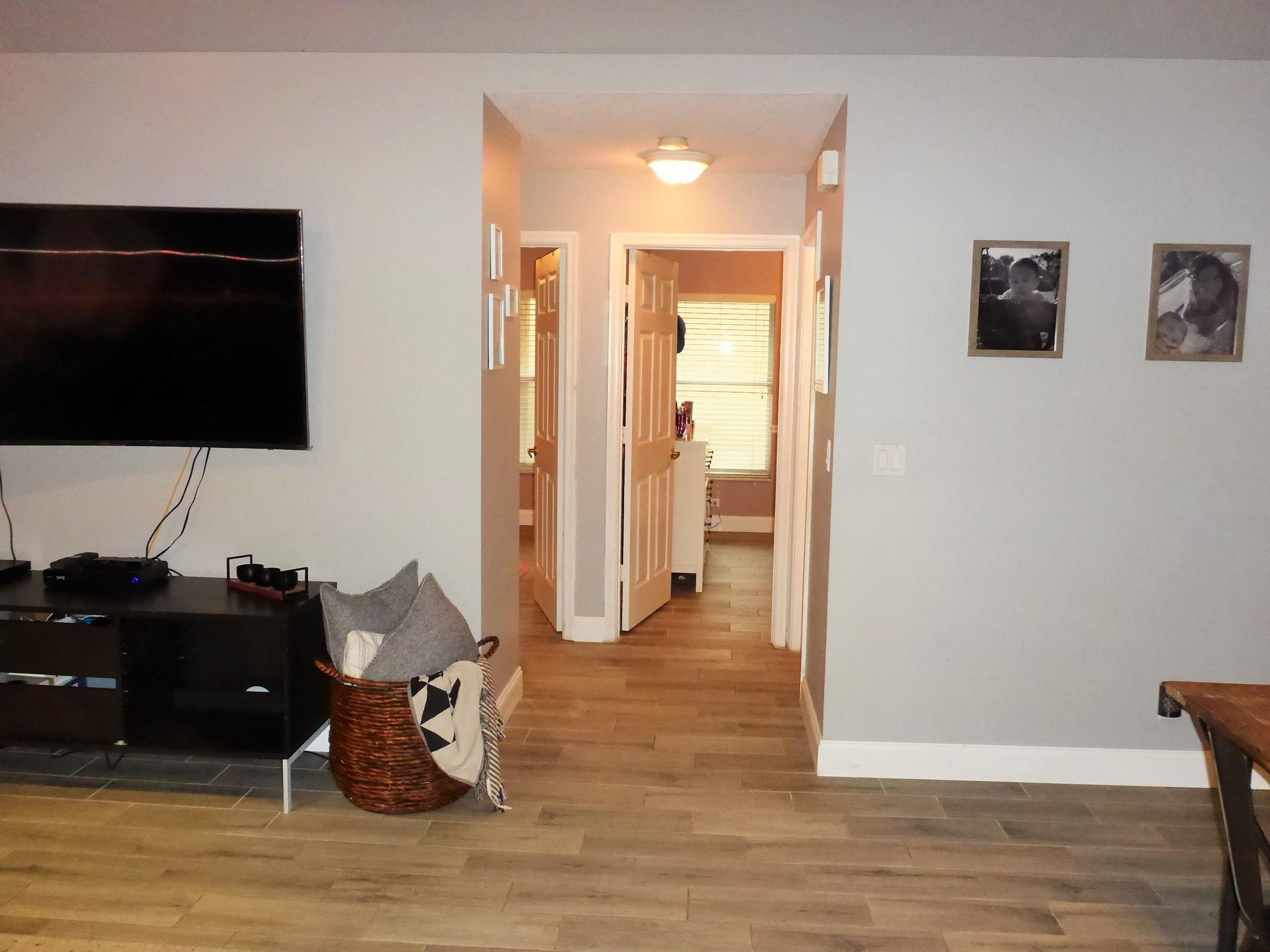 5009 Elpine Way Riviera Beach, FL 33418 - Photo 23 of 41 a living room with furniture and a flat screen tv