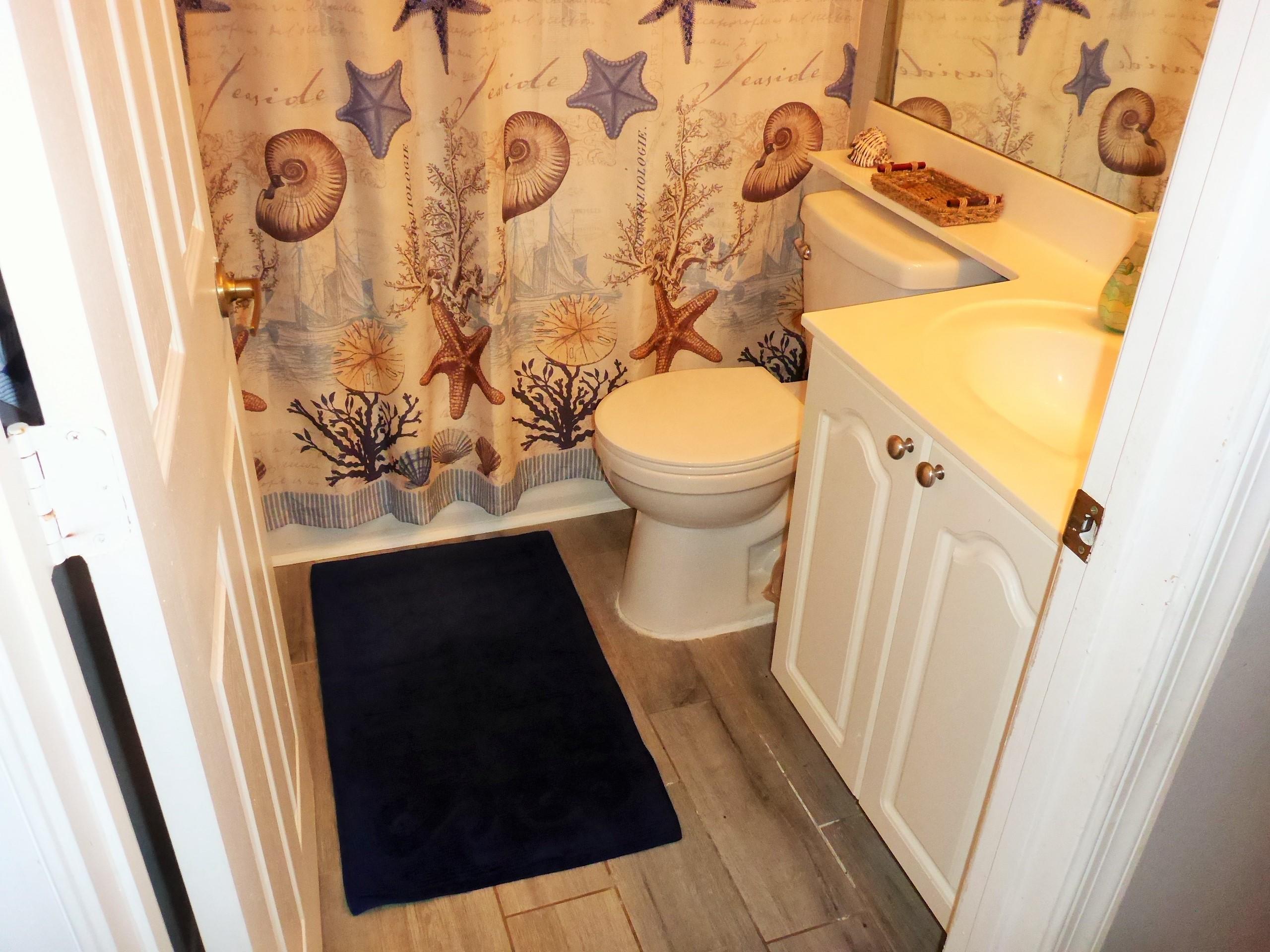 5009 Elpine Way Riviera Beach, FL 33418 - Photo 27 of 41 a bathroom with a sink and a mirror