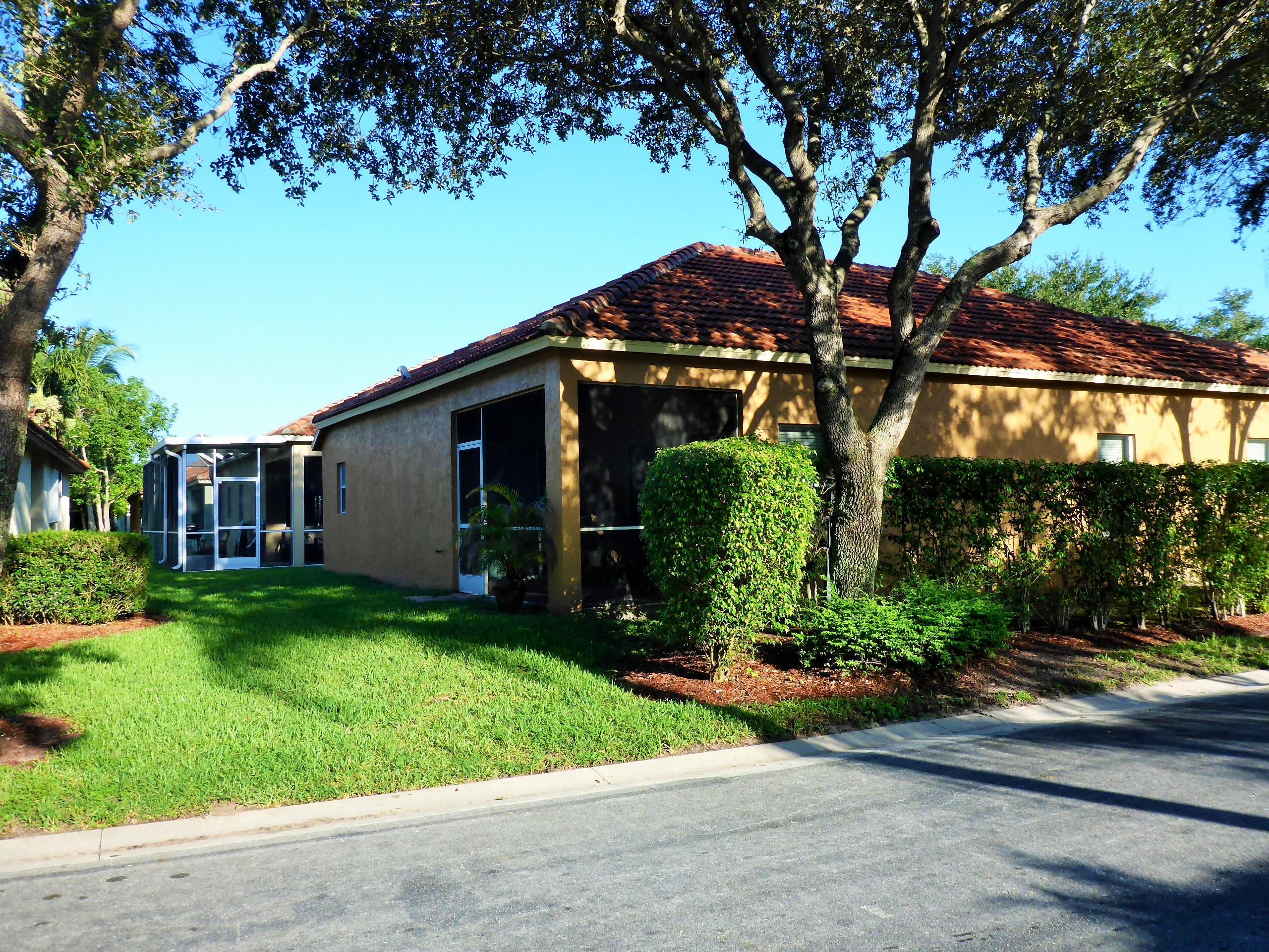 5009 Elpine Way Riviera Beach, FL 33418 - Photo 39 of 41 a view of a house with backyard and garden