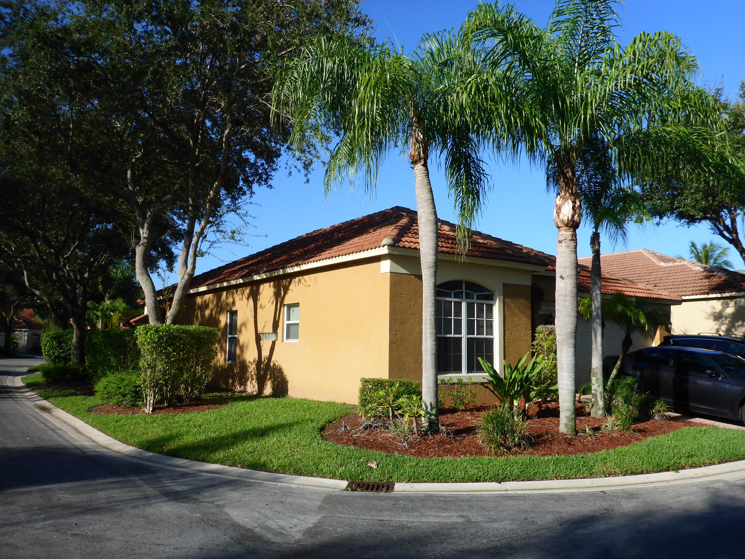 5009 Elpine Way Riviera Beach, FL 33418 - Photo 41 of 41 a front view of a house with garden