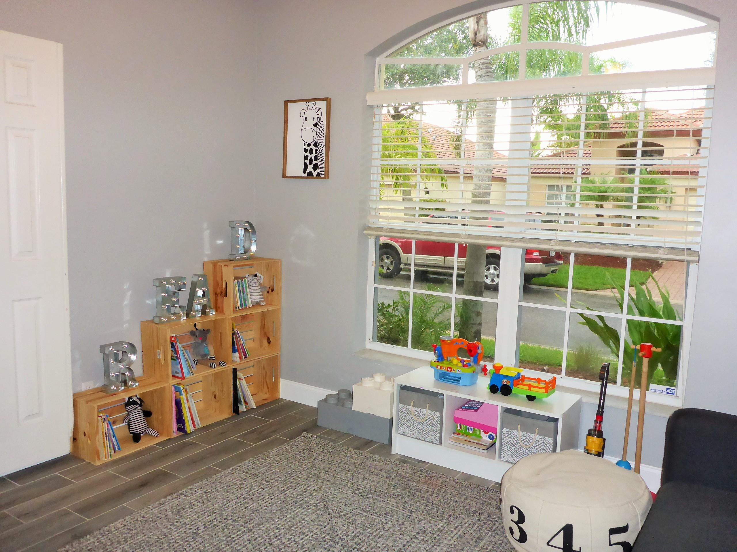 5009 Elpine Way Riviera Beach, FL 33418 - Photo 7 of 41 a children room with furniture and a large window