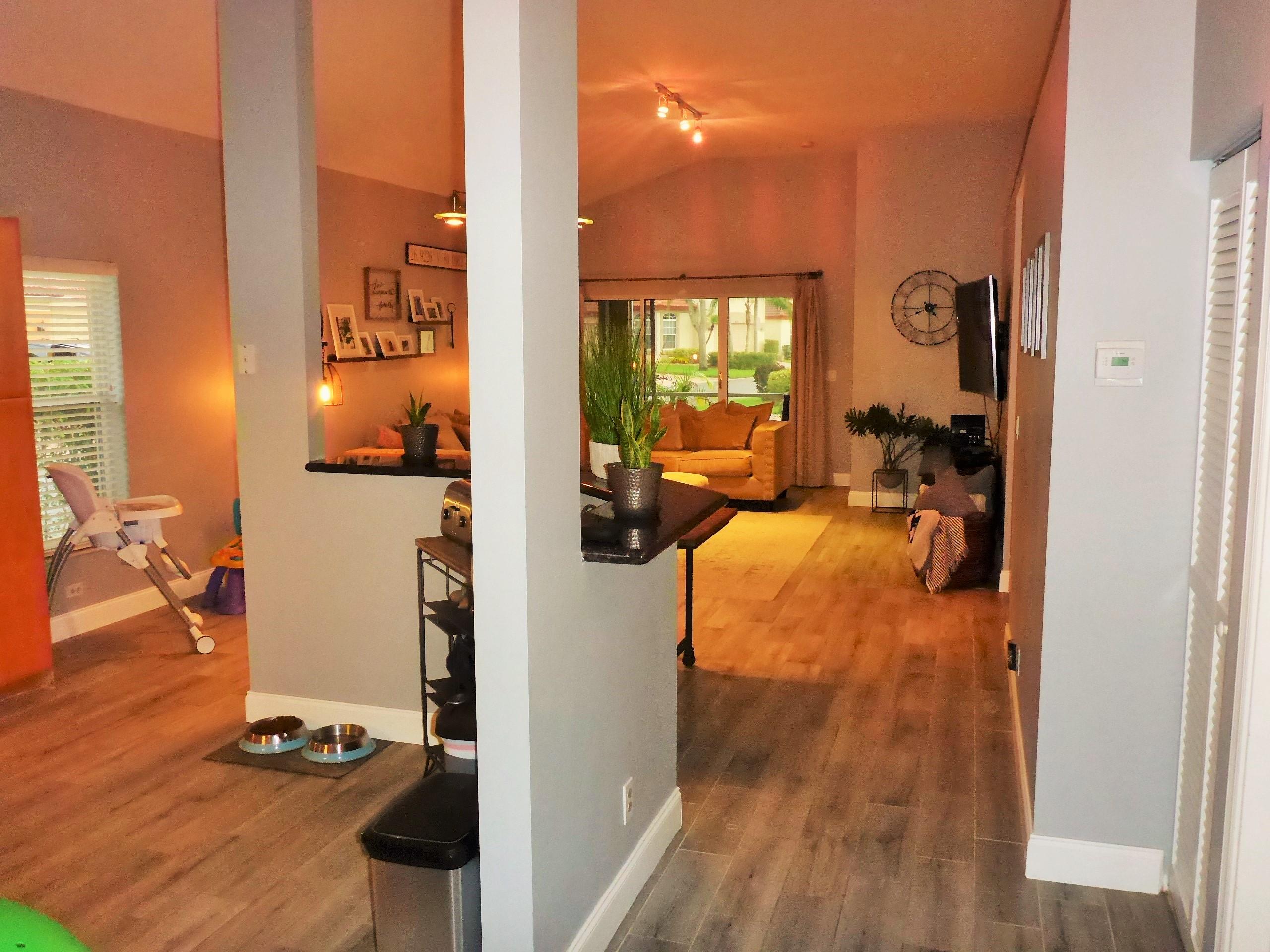5009 Elpine Way Riviera Beach, FL 33418 - Photo 9 of 41 a view of living room with furniture and wooden floor