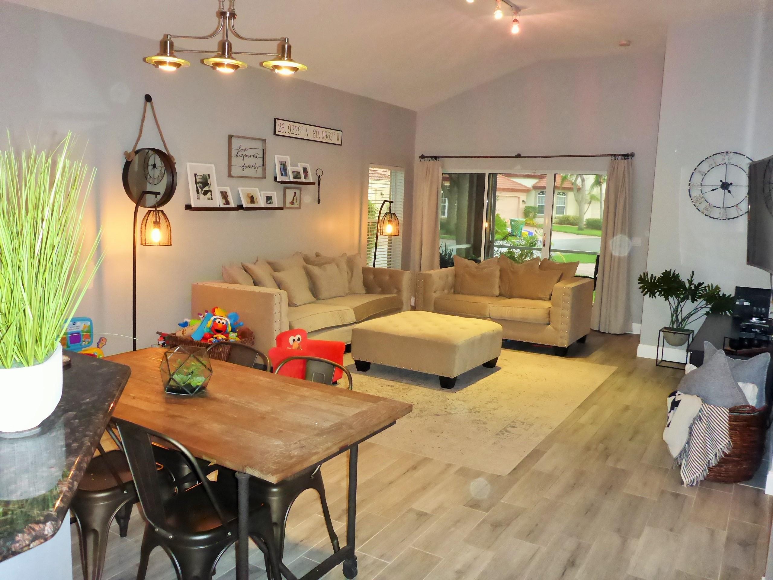 5009 Elpine Way Riviera Beach, FL 33418 - Photo 10 of 41 a living room with furniture and wooden floor