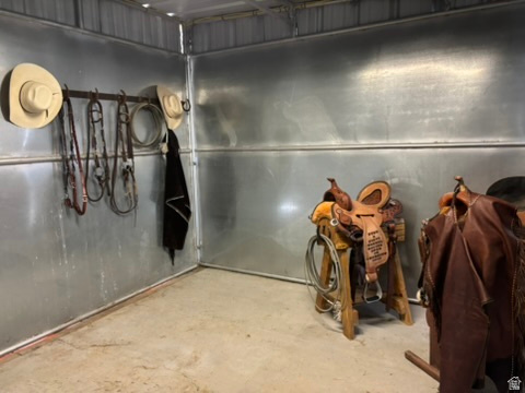3732 Campbell Road Tooele, UT 84074 - Photo 7 of 69 Utility space featuring corrugated metal walls, concrete flooring, and built-in wall hooks