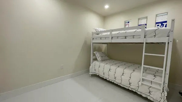 a bedroom with a bed and a desk