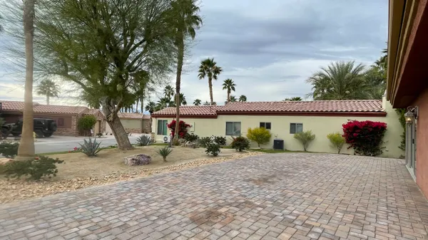 a view of a big yard in front of a house
